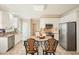 Modern kitchen featuring white cabinets, granite countertops, stainless steel appliances, and a breakfast bar at 3130 Crestmont Nw Way, Kennesaw, GA 30152