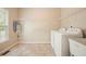 Functional laundry room with modern appliances, ample storage, and bright natural light at 3130 Crestmont Nw Way, Kennesaw, GA 30152