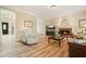 Comfortable living room with hardwood floors, fireplace, and a doorway to the foyer at 3130 Crestmont Nw Way, Kennesaw, GA 30152