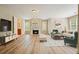 Bright and airy living room features a fireplace, hardwood floors, and ample seating at 3130 Crestmont Nw Way, Kennesaw, GA 30152