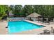 Community pool with tennis court, lounge chairs, and pergola for outdoor enjoyment at 3130 Crestmont Nw Way, Kennesaw, GA 30152