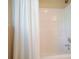 Shower with white shower curtain, light walls, and chrome shower head fixture at 3130 Crestmont Nw Way, Kennesaw, GA 30152