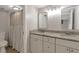 Bathroom featuring double sinks, granite counters, and vanity; creating a spa-like experience at 41 Cantey Nw Pl, Atlanta, GA 30327