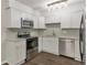 Updated kitchen with stainless steel appliances, granite countertops, and backsplash at 41 Cantey Nw Pl, Atlanta, GA 30327