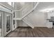 Open floor plan with hardwood floors, staircase, and kitchen with modern appliances at 41 Cantey Nw Pl, Atlanta, GA 30327
