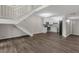 Open floor plan with hardwood floors, staircase, and kitchen with modern appliances at 41 Cantey Nw Pl, Atlanta, GA 30327