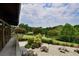 Scenic patio view with outdoor seating overlooking a tranquil lake and lush greenery at 41 Cantey Nw Pl, Atlanta, GA 30327