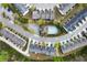 An aerial view showcases a residential community with a pool, surrounded by lush greenery and well-maintained homes at 5556 Cascade Sw Run, Atlanta, GA 30336