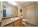 Bathroom featuring a sink, vanity, toilet, and bathtub with shower at 5556 Cascade Sw Run, Atlanta, GA 30336