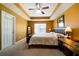 Bedroom with trey ceiling, ceiling fan, neutral carpet, and natural light at 5556 Cascade Sw Run, Atlanta, GA 30336