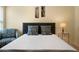 Close up on bedroom with comfy pillows, chair, and lamps at 5556 Cascade Sw Run, Atlanta, GA 30336
