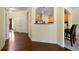 Open hallway with hardwood floors leading to the kitchen at 5556 Cascade Sw Run, Atlanta, GA 30336