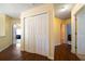 Bright hallway with hardwood flooring, fresh paint, closet, and access to other rooms at 5556 Cascade Sw Run, Atlanta, GA 30336