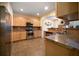 Well-lit kitchen featuring stainless steel appliances and ample counter space at 5556 Cascade Sw Run, Atlanta, GA 30336
