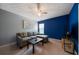 Cozy living room with gray sofa, ottoman, TV, and modern decor at 5556 Cascade Sw Run, Atlanta, GA 30336
