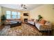 Cozy living room features a fireplace and plush seating at 5556 Cascade Sw Run, Atlanta, GA 30336