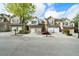 Charming townhomes with neat driveways, attached garages, and manicured landscaping on a quiet, tree-lined street at 5556 Cascade Sw Run, Atlanta, GA 30336