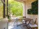 Charming outdoor balcony with table and chairs, creating a cozy and inviting space at 70 Sheridan Ne Dr # 10, Atlanta, GA 30305
