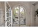 Arched glass doors open to a cozy balcony with a neighborhood view at 70 Sheridan Ne Dr # 10, Atlanta, GA 30305