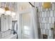Well-lit bathroom with a unique tile design, sleek vanity, and glass shower door at 70 Sheridan Ne Dr # 10, Atlanta, GA 30305