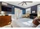 Comfortable bedroom featuring hardwood floors, a ceiling fan, and a large window providing natural light at 70 Sheridan Ne Dr # 10, Atlanta, GA 30305