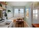 Charming breakfast nook with built-in bench seating, natural light, and open shelving for a cozy dining experience at 70 Sheridan Ne Dr # 10, Atlanta, GA 30305