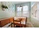 Sunlit breakfast nook featuring a built-in bench, wooden table, and bright windows at 70 Sheridan Ne Dr # 10, Atlanta, GA 30305