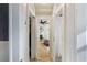 Hallway featuring bright white trim and doors, hardwood floors, and access to the living room at 70 Sheridan Ne Dr # 10, Atlanta, GA 30305