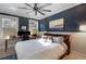 Comfortable main bedroom with a ceiling fan, desk area, and large windows at 70 Sheridan Ne Dr # 10, Atlanta, GA 30305