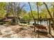 Community pool area showcasing an inground pool with patio furniture, swing set and landscaping at 70 Sheridan Ne Dr # 10, Atlanta, GA 30305