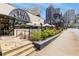 The Salty Donut shop featuring an outdoor patio, umbrellas, and modern urban architecture at 70 Sheridan Ne Dr # 10, Atlanta, GA 30305