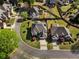 Aerial view displays home's landscaped yard, dark roof, and surrounding greenery at 341 Declaire Ne Way, Marietta, GA 30067