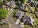Aerial view showing multiple landscaped homes on a green treelined street at 341 Declaire Ne Way, Marietta, GA 30067