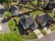 Aerial view showcasing a home with well-maintained lawn, landscape, and a dark roof at 341 Declaire Ne Way, Marietta, GA 30067