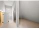 Attic space featuring carpeted floors and a window for natural lighting at 341 Declaire Ne Way, Marietta, GA 30067