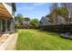 Spacious backyard with a green lawn, complemented by mature trees and landscaping at 341 Declaire Ne Way, Marietta, GA 30067