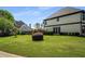 Expansive backyard with lush green lawn, manicured shrubs, and privacy landscaping at 341 Declaire Ne Way, Marietta, GA 30067
