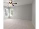 Spacious bedroom featuring neutral paint, carpet, and fan at 341 Declaire Ne Way, Marietta, GA 30067