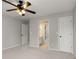 Bedroom view showcasing neutral paint and access to bathroom at 341 Declaire Ne Way, Marietta, GA 30067