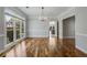Elegant dining room with hardwood floors, a chandelier, and large windows overlooking the yard at 341 Declaire Ne Way, Marietta, GA 30067