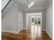 Welcoming entryway with hardwood floors, staircase, and a view into the living room at 341 Declaire Ne Way, Marietta, GA 30067