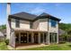 Back exterior of home with large windows, doors, and outdoor patio at 341 Declaire Ne Way, Marietta, GA 30067