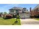 Elegant two-story home boasting a well-manicured lawn, two-car garage and manicured landscaping at 341 Declaire Ne Way, Marietta, GA 30067