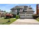 Elegant two-story home boasting a well-manicured lawn, two-car garage and manicured landscaping at 341 Declaire Ne Way, Marietta, GA 30067