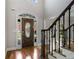 Grand foyer with hardwood floors, a stained-glass front door, and staircase with decorative iron spindles at 341 Declaire Ne Way, Marietta, GA 30067
