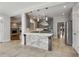 Stylish kitchen featuring gray cabinets, a stone-clad island, and stainless steel appliances at 341 Declaire Ne Way, Marietta, GA 30067