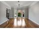 Light-filled living room with hardwood floors, arched windows, and views of the landscaped exterior at 341 Declaire Ne Way, Marietta, GA 30067