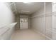 This walk-in closet has carpet, shelving, and a built-in cabinet with drawers and a mirror at 341 Declaire Ne Way, Marietta, GA 30067
