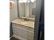 Bathroom vanity with granite countertop, framed mirror, and modern sink at 3518 Shepherds Path, Decatur, GA 30034