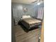 Bedroom features grey walls, hardwood floors, window and ceiling fan at 3518 Shepherds Path, Decatur, GA 30034